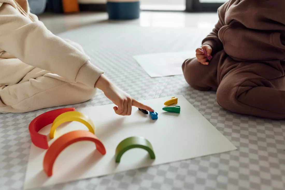 high-angle-view-baby-girl-playing-with-toy-blocks